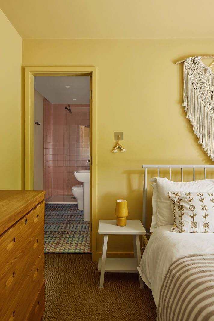 A Modern Bungalow with a Terrazzo Kitchen and Magnificent Views 21 yellow bedroom