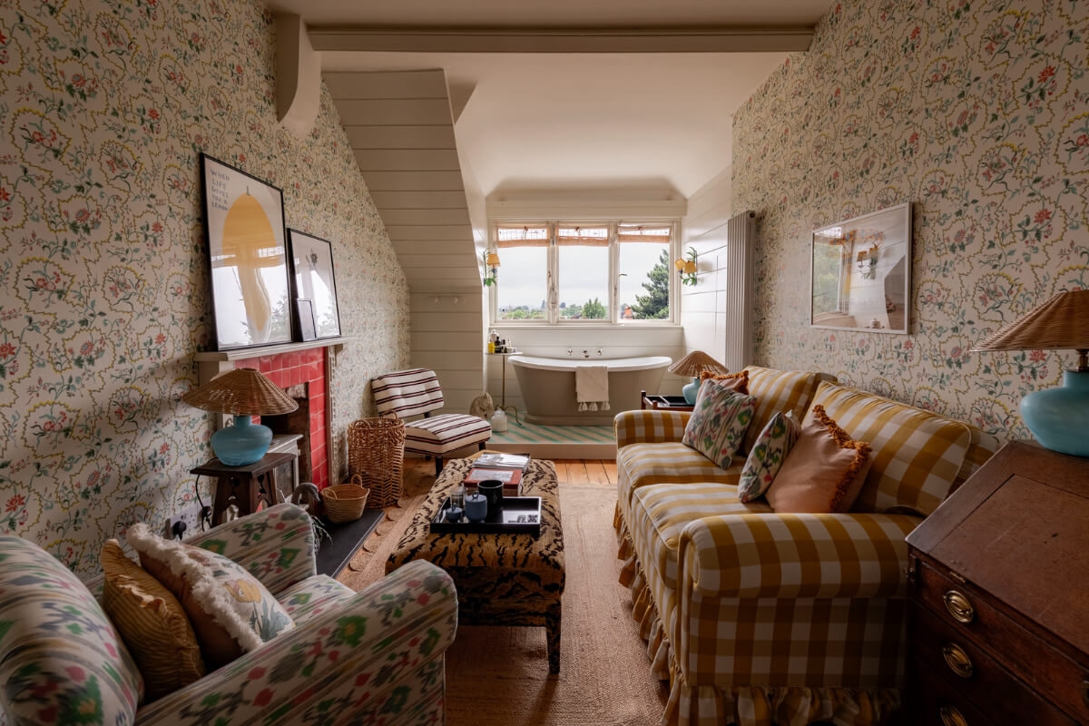 A Colorful Eclectic Victorian Maisonette Home in England 16 attic room with freestanding bath and fireplace