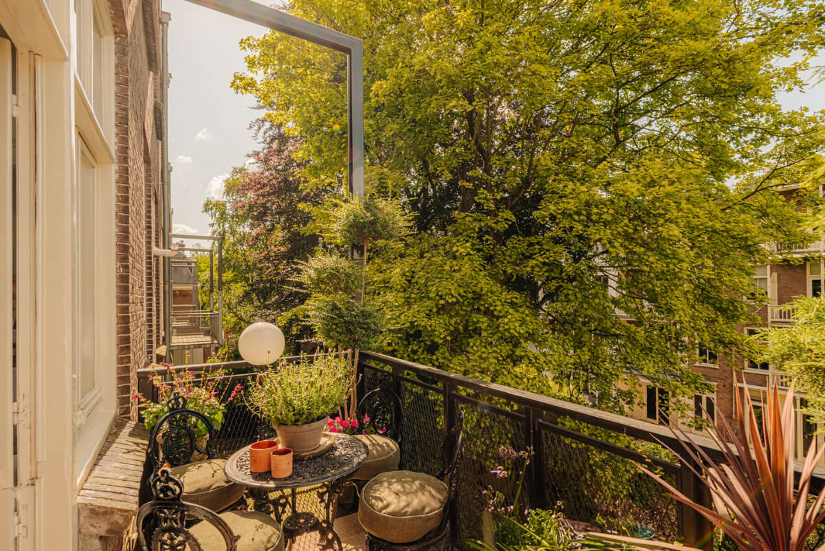 A Luxurious Parisian-Inspired Apartment in Amsterdam 8 balcony large trees