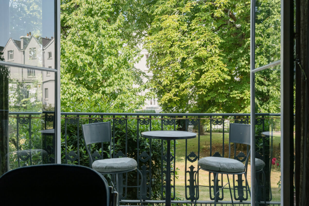 A Rich Color and Material Palette in a Small Victorian Apartment 8 balcony overlooking communal garden
