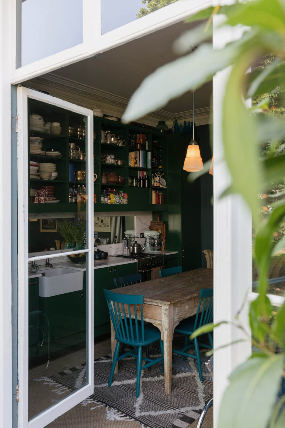 A Rich Color and Material Palette in a Small Victorian Apartment 9 balcony view into kitchen spac