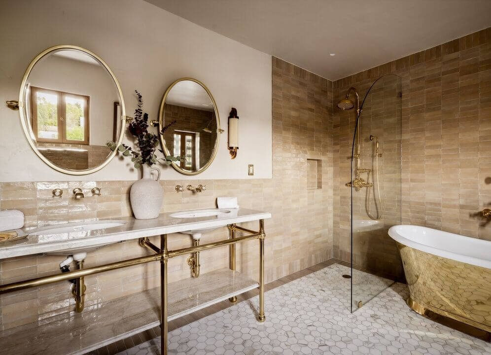 The Top Home Design Trends for 2026: Bold Color, Cozy Corners & Climate-Ready Living 22 bathroom double shower and sinks gold tub