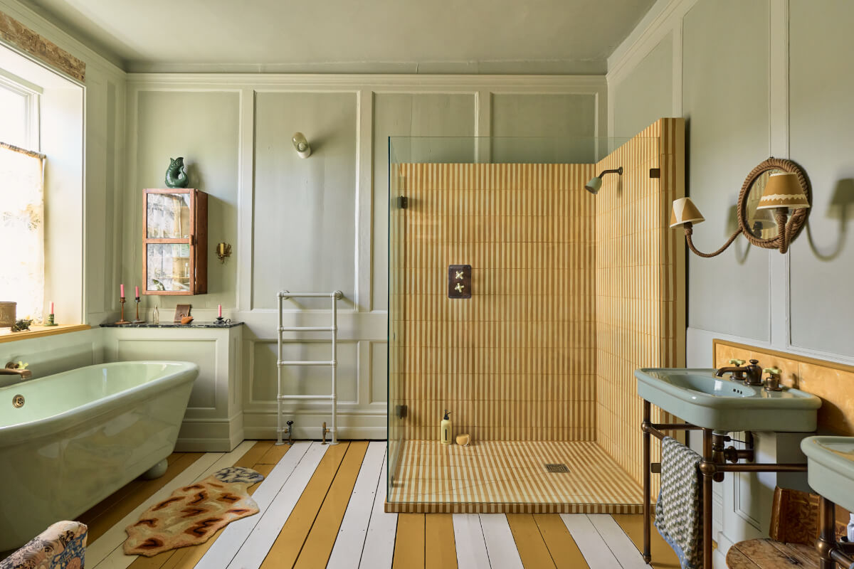 A Colored Sixth Wall May Be The Biggest Paint Trend in 2026 1 bathroom large shower freestanding bath painted wooden floorboards