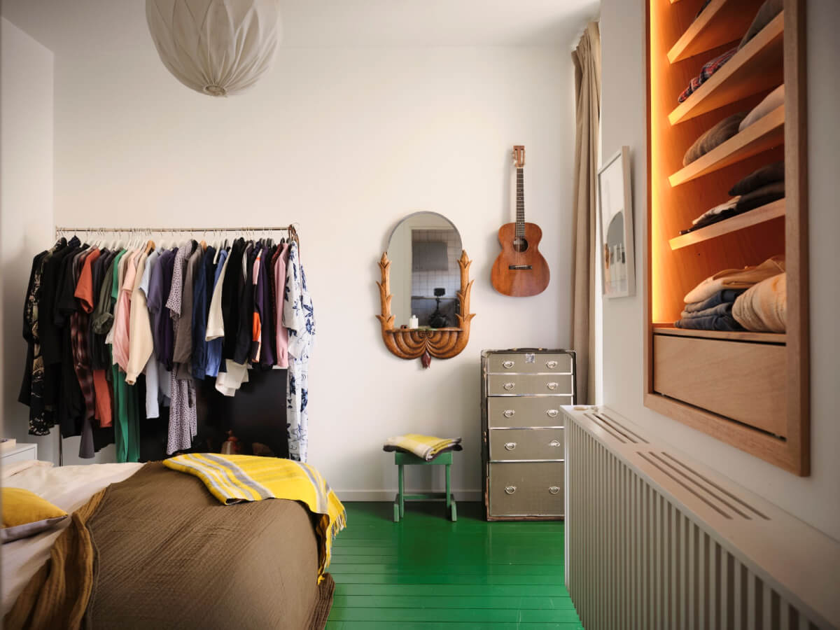 A Colored Sixth Wall May Be The Biggest Paint Trend in 2026 14 bedroom green painted wooden floorboards clothing rack