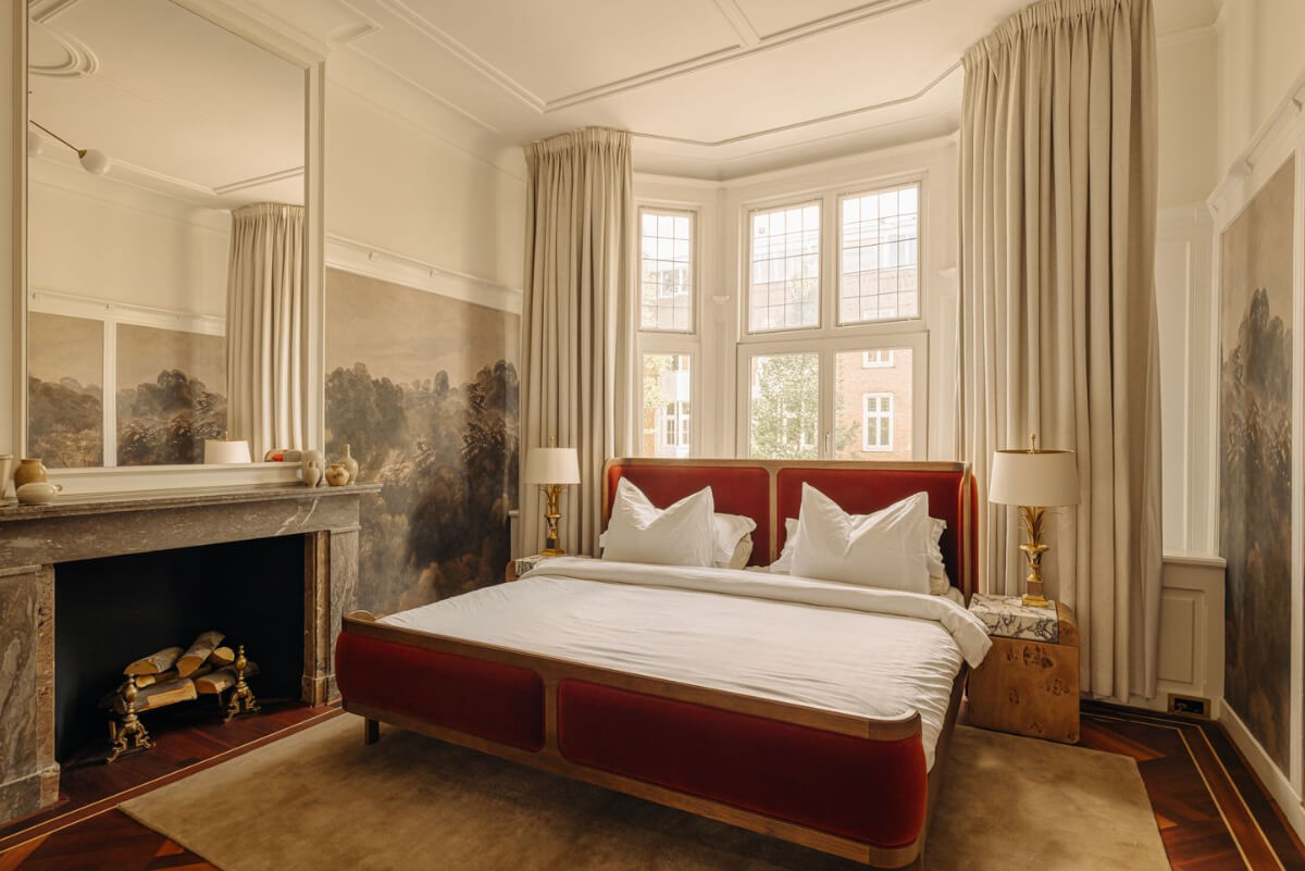A Luxurious Parisian-Inspired Apartment in Amsterdam 15 bedroom mural fireplace velvet bedframe