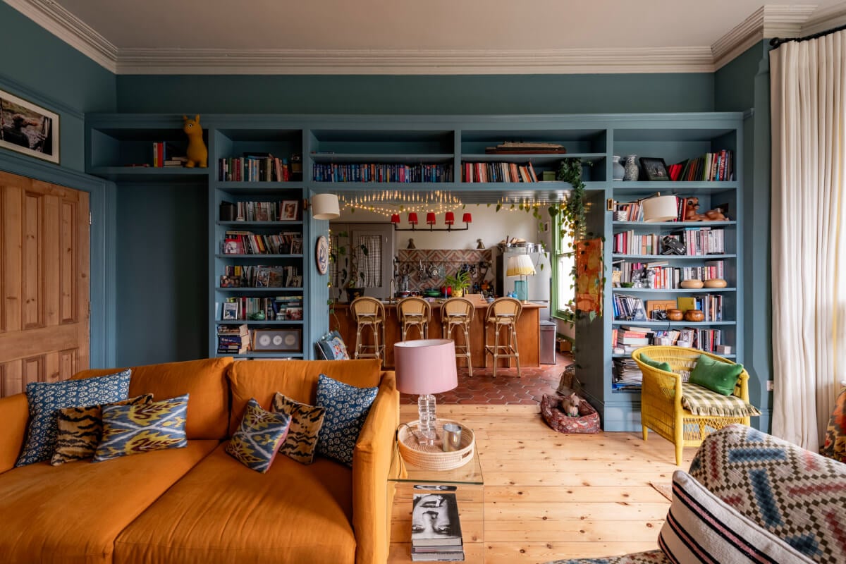 A Colorful Eclectic Victorian Maisonette Home in England 1 blue kitchen living room built-in bookshelves
