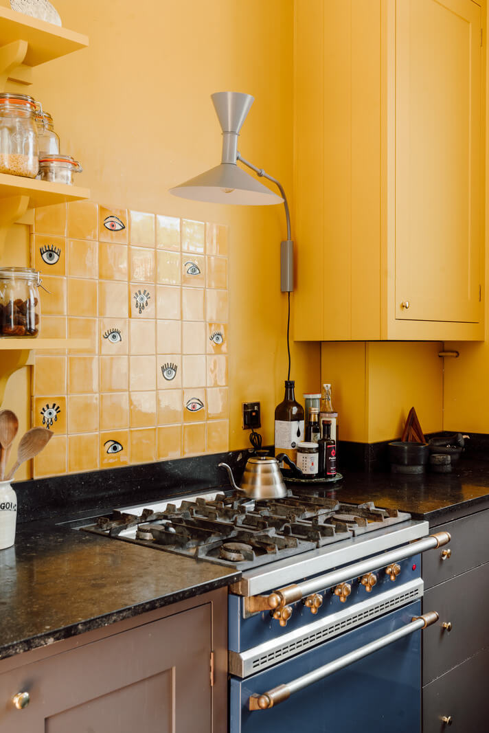 Pastel Tones and Deep Yellow in an Early 20th-Century London Apartment 11 blue stove yellow walls and tiles