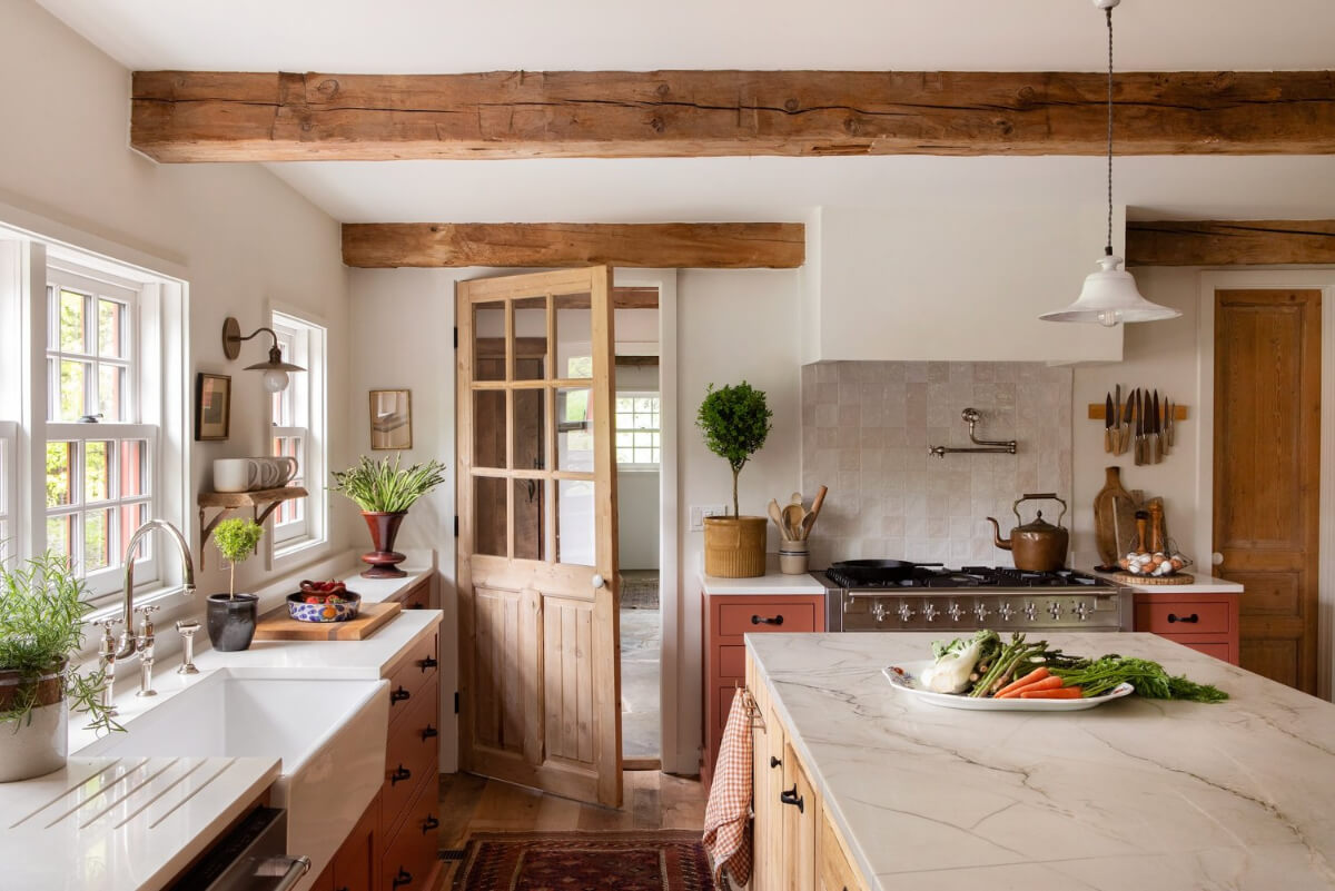Best of 2025: Kitchens 79 butler sink under window terracotta colored cabinets