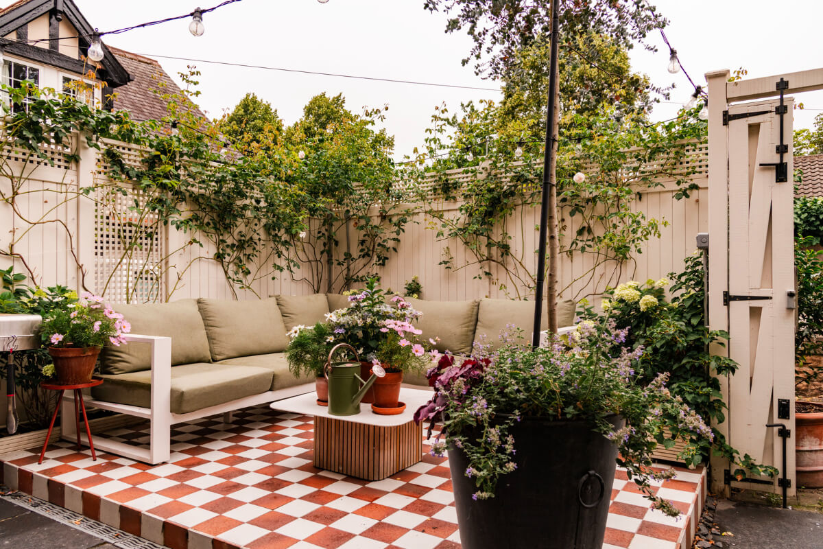A Colorful Eclectic Victorian Maisonette Home in England 33 city garden lounge area checkerboard tile floor