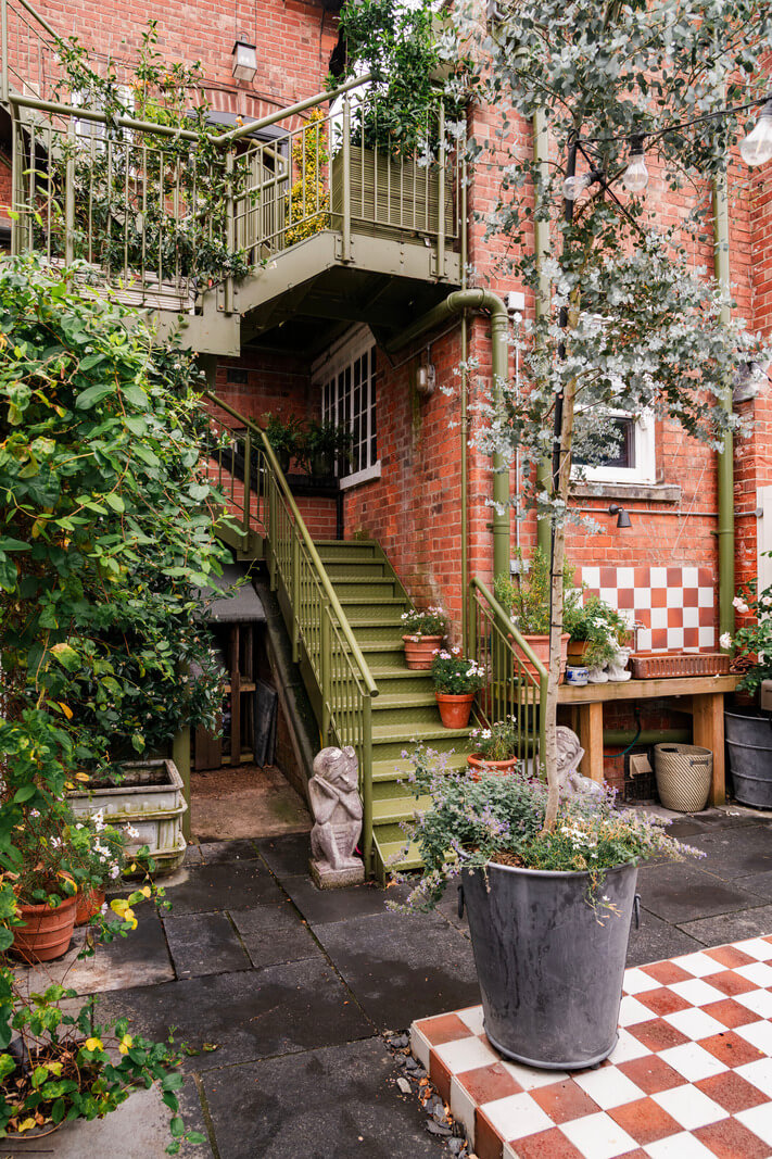 A Colorful Eclectic Victorian Maisonette Home in England 31 city garden plants green staircase