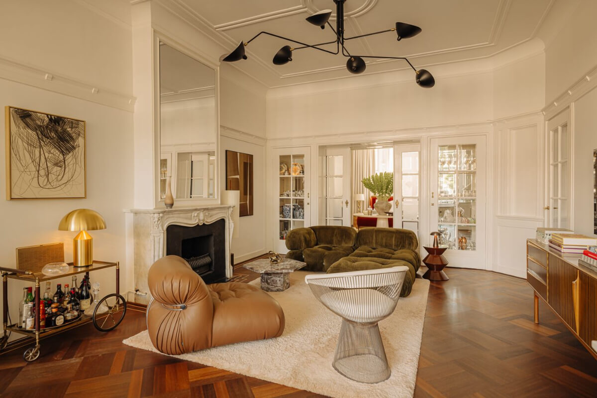 A Luxurious Parisian-Inspired Apartment in Amsterdam 1 classic living room green sofa marble fireplace