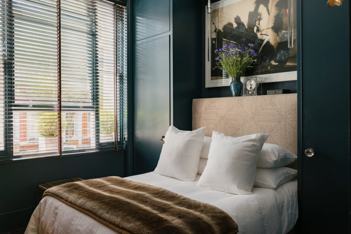 A Rich Color and Material Palette in a Small Victorian Apartment 17 dark blue bedroom built-in wardrobes