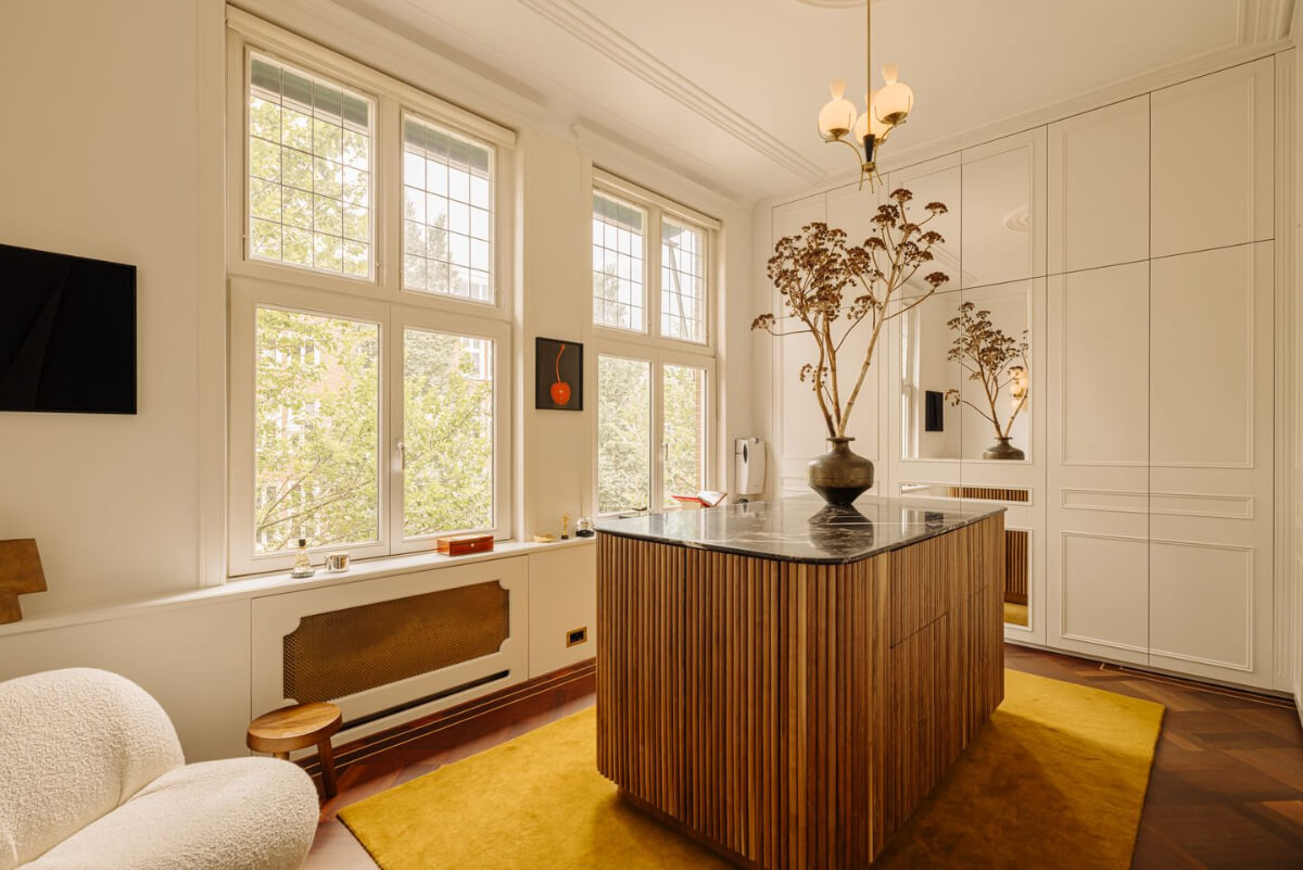 A Luxurious Parisian-Inspired Apartment in Amsterdam 18 dressing room yellow rug built-in wardrobes