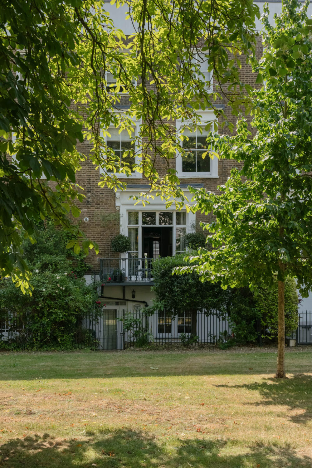 A Rich Color and Material Palette in a Small Victorian Apartment 22 exterior communal garden balcony