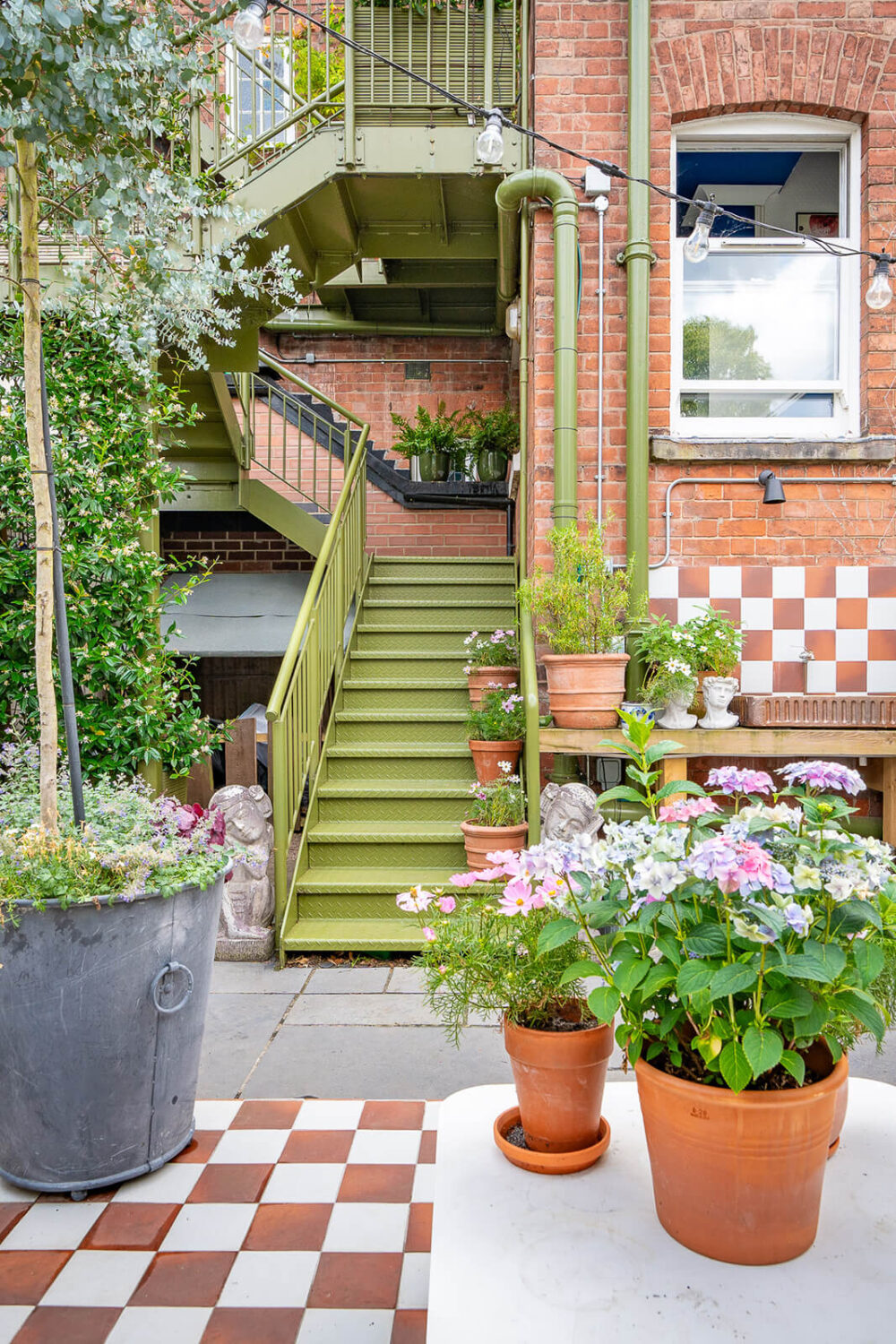 A Colorful Eclectic Victorian Maisonette Home in England 32 garden green staircase