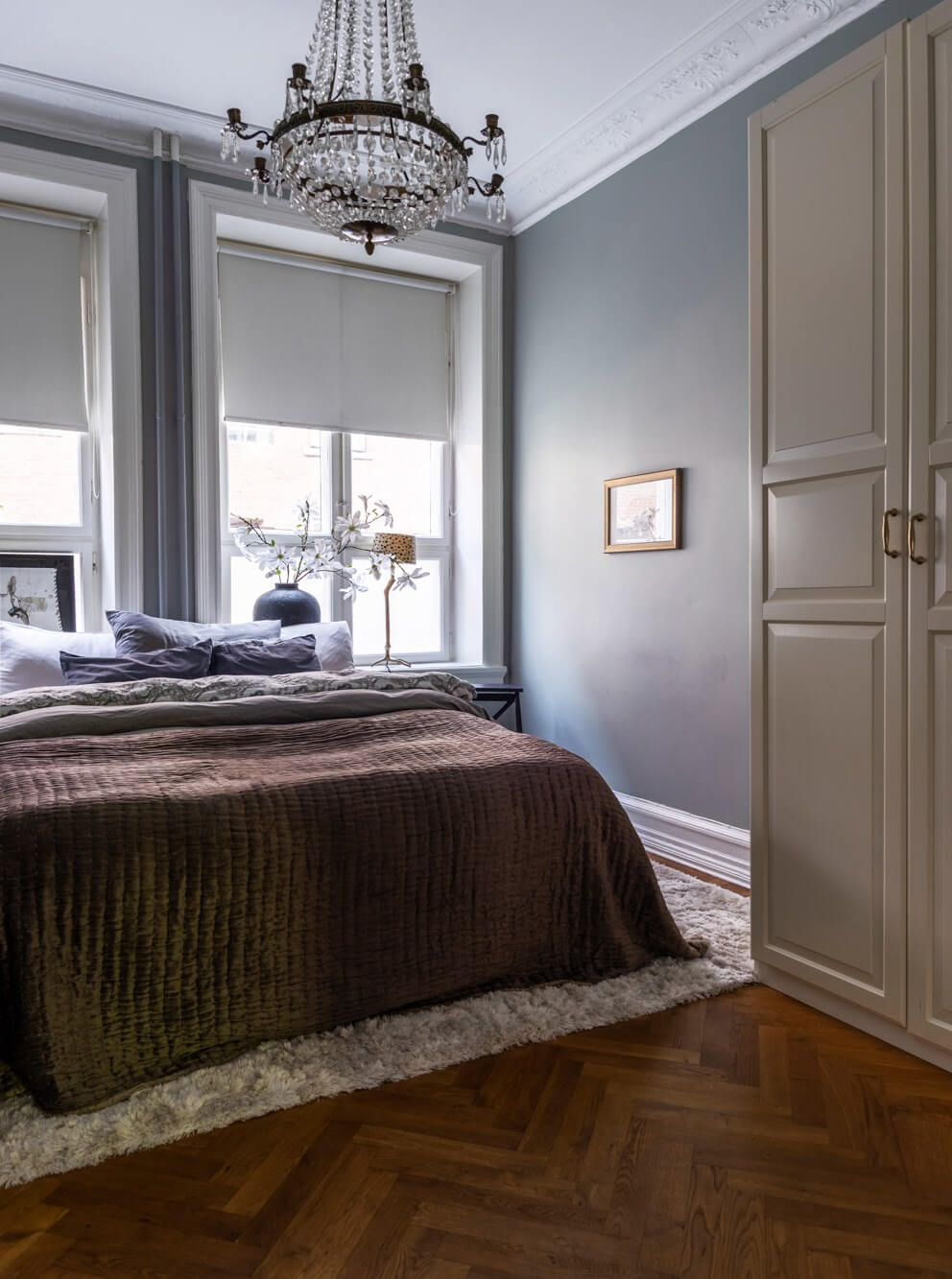 Classic Proportions and a Charming Kitchen in a Malmö Apartment 11 gray bedroom herringbone parquet floor