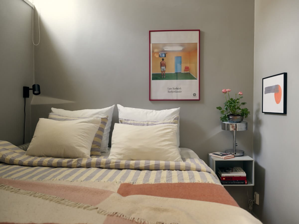 A Tiny Apartment with a Semi-Open Floorplan and a Pink Kitchen 15 gray bedroom niche floating nightstand