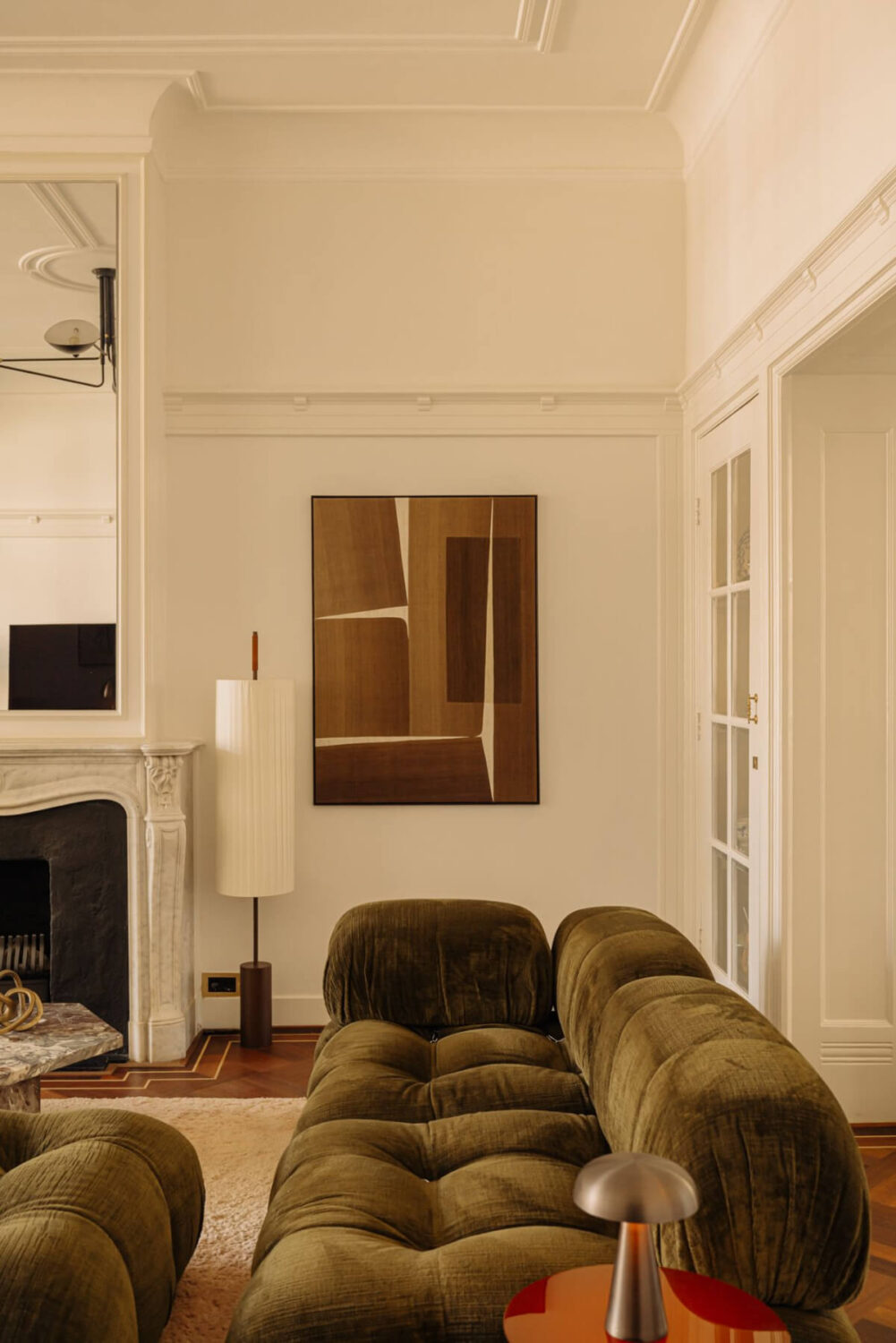 A Luxurious Parisian-Inspired Apartment in Amsterdam 3 green sofa living room