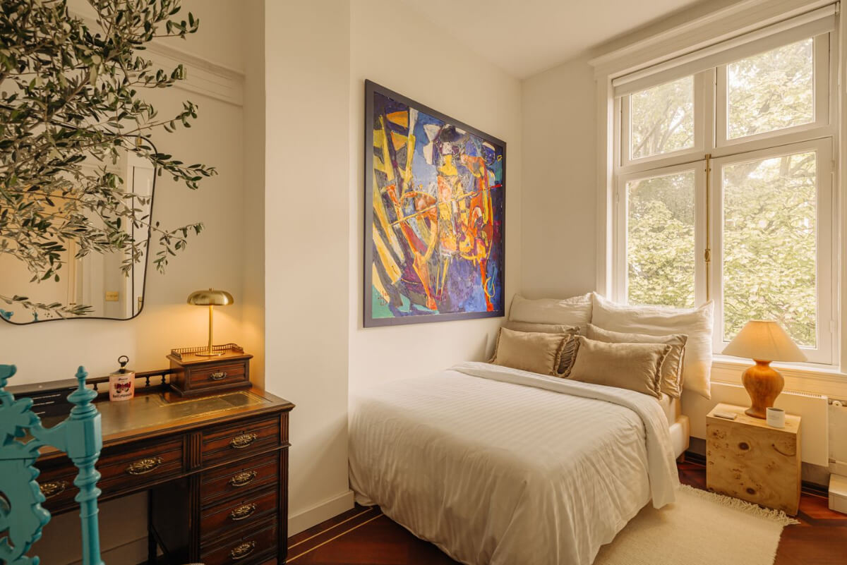 A Luxurious Parisian-Inspired Apartment in Amsterdam 20 guest bedroom with antique desk