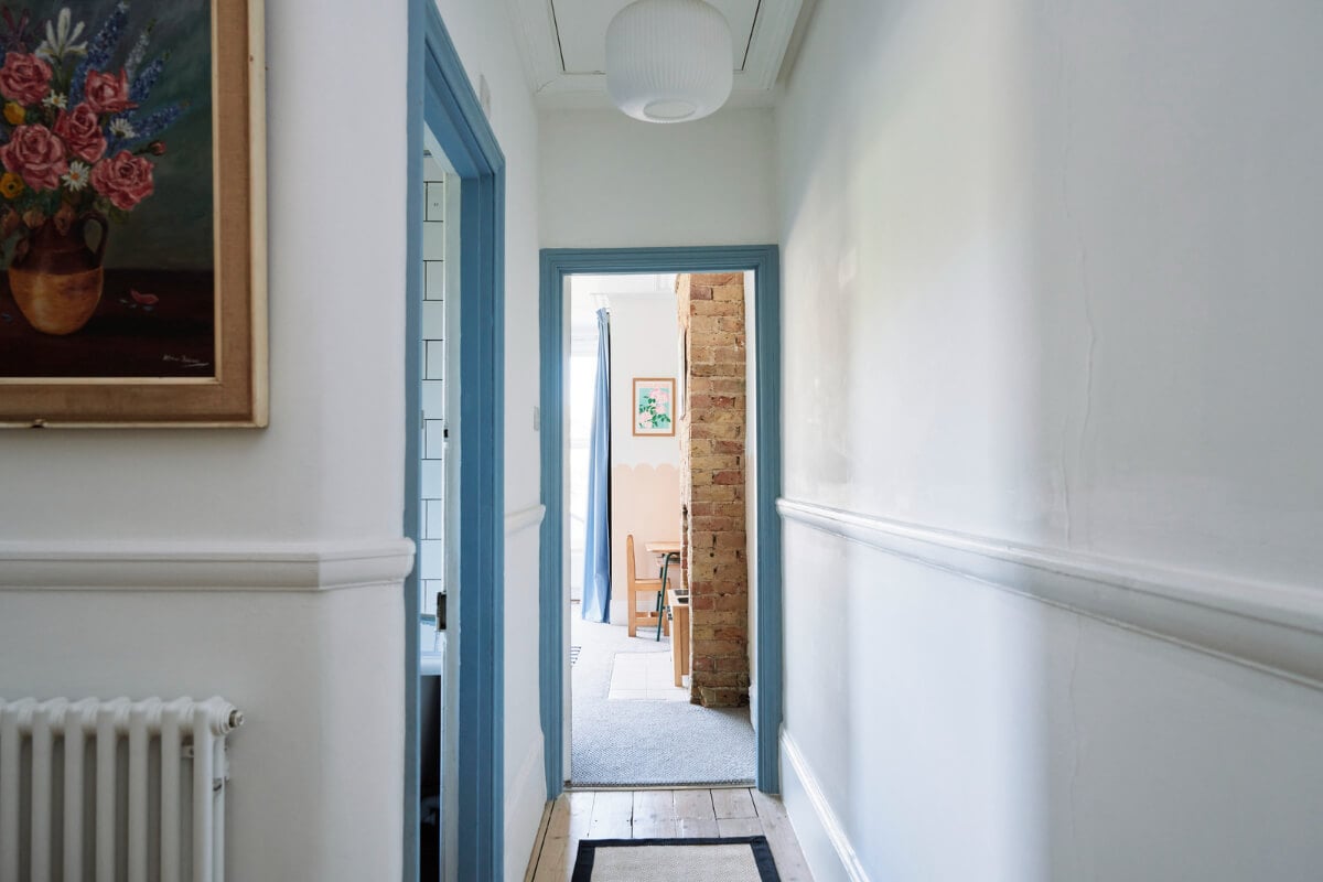 Colorful Rooms and a Modern Kitchen in a Spacious Family Home 17 hall blue doorframes
