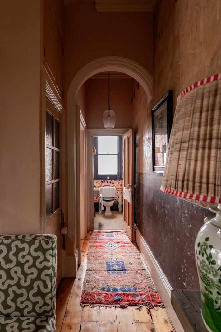 A Colorful Eclectic Victorian Maisonette Home in England 14 hallway wooden floorboards