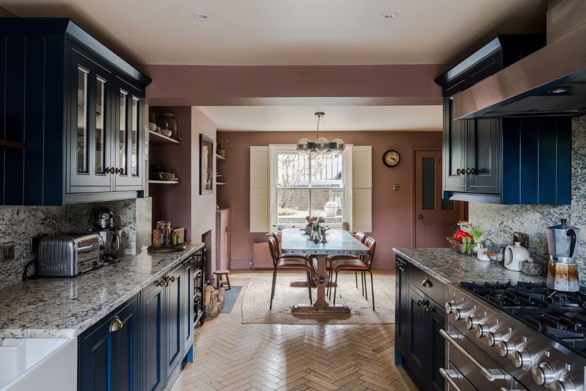 A Victorian Home with a Rich Color Palette and a Beautiful Garden 8 kitchen and dining room blue cabinets
