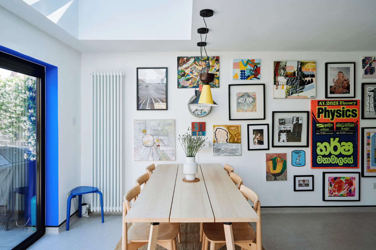 Colorful Rooms and a Modern Kitchen in a Spacious Family Home 8 kitchen dining table gallery wall