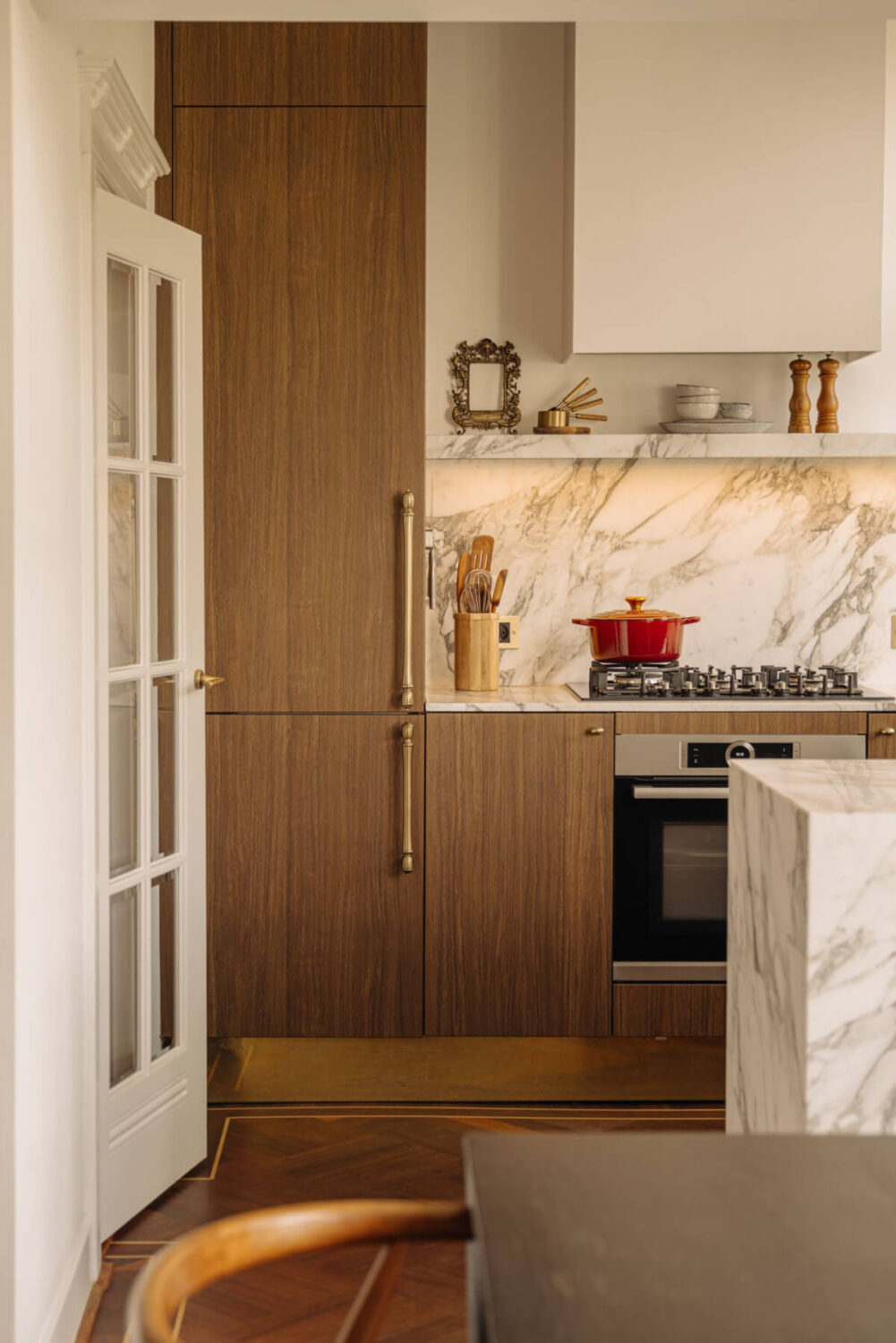 A Luxurious Parisian-Inspired Apartment in Amsterdam 10 kitchen marble countertop backsplash
