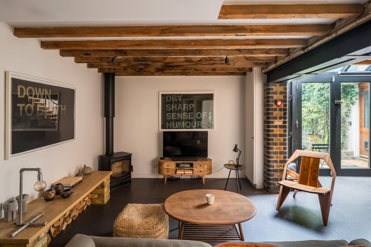 An Industrial Mews House with a Sebastian Cox deVOL Kitchen 2 living room exposed wooden beams mews house
