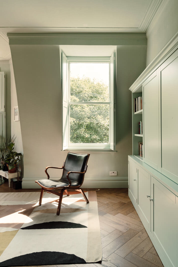 Pastel Tones and Deep Yellow in an Early 20th-Century London Apartment 7 living room herringbone floor