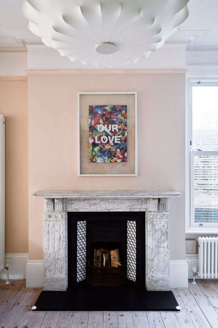 Colorful Rooms and a Modern Kitchen in a Spacious Family Home 9 marble fireplace
