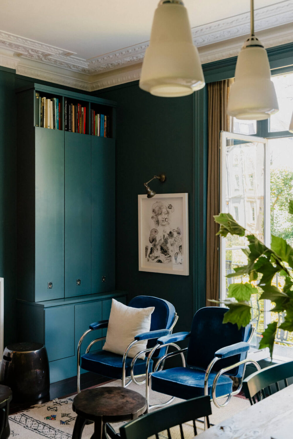 A Rich Color and Material Palette in a Small Victorian Apartment 11 moody sitting room with balcony doors