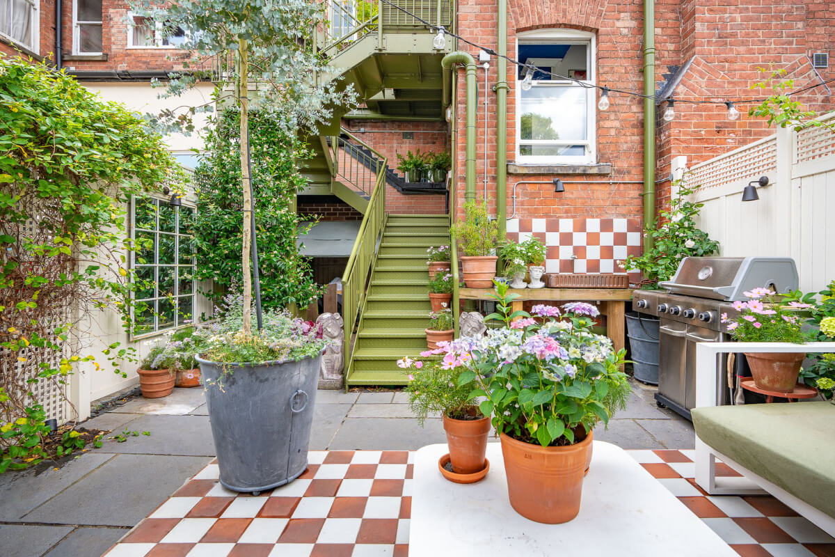 A Colorful Eclectic Victorian Maisonette Home in England 30 paved city garden checkerboard details