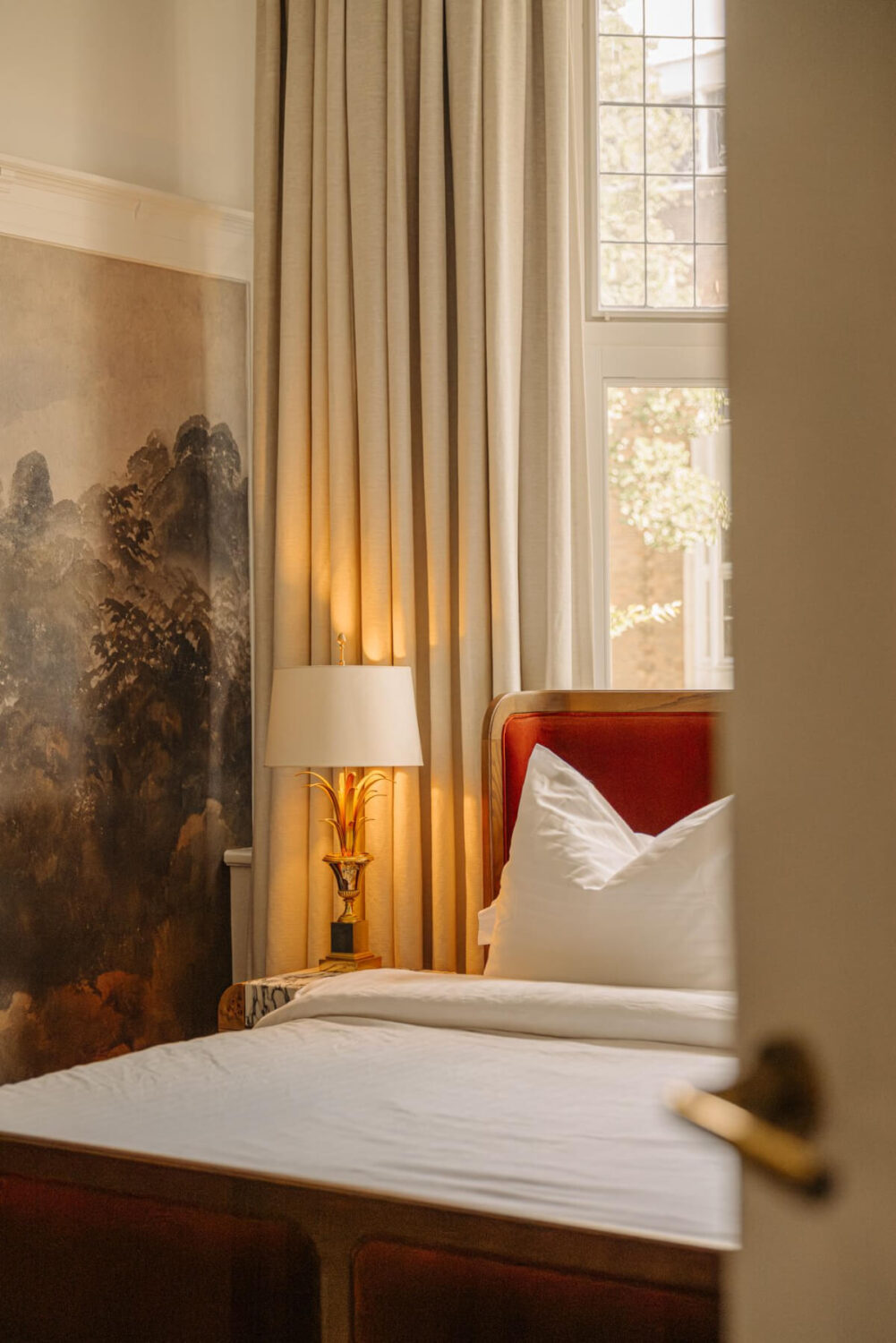 A Luxurious Parisian-Inspired Apartment in Amsterdam 14 peek into bedroom