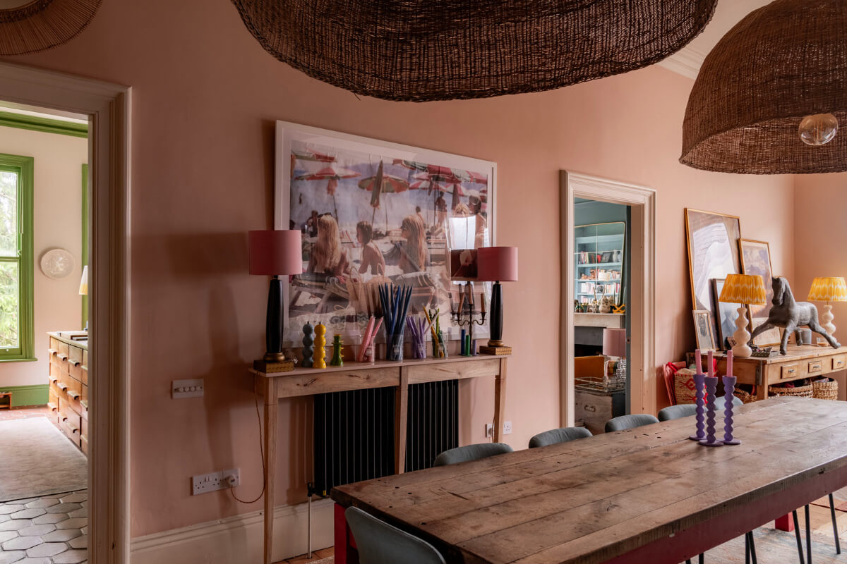 A Colorful Eclectic Victorian Maisonette Home in England 8 pink dining room rustic wooden table