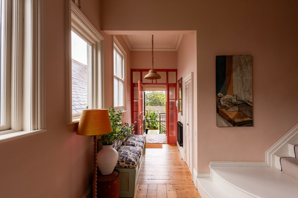 A Colorful Eclectic Victorian Maisonette Home in England 12 pink hall wooden floorboards