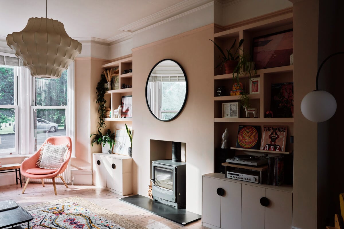 Colorful Rooms and a Modern Kitchen in a Spacious Family Home 2 pink living room fireplace built-in shelves
