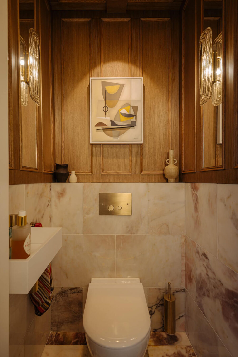 A Luxurious Parisian-Inspired Apartment in Amsterdam 25 powder room with oak paneling
