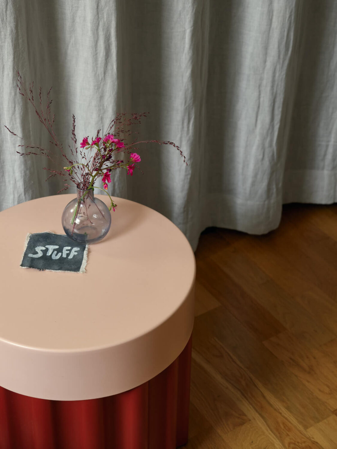 A Tiny Apartment with a Semi-Open Floorplan and a Pink Kitchen 13 side table detail