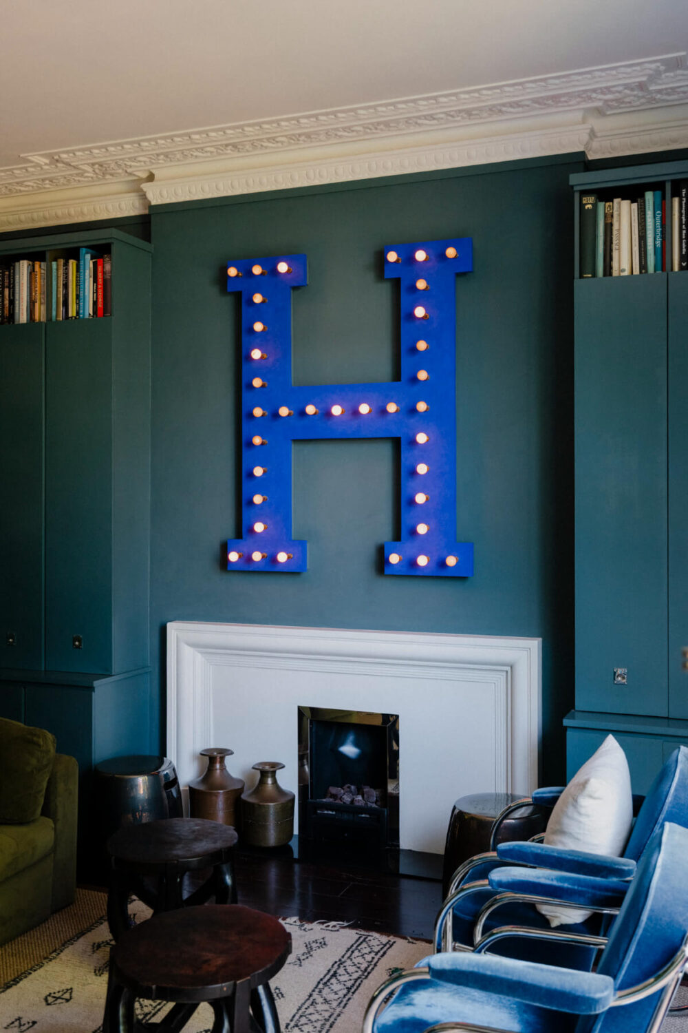 A Rich Color and Material Palette in a Small Victorian Apartment 12 sitting room white fireplace