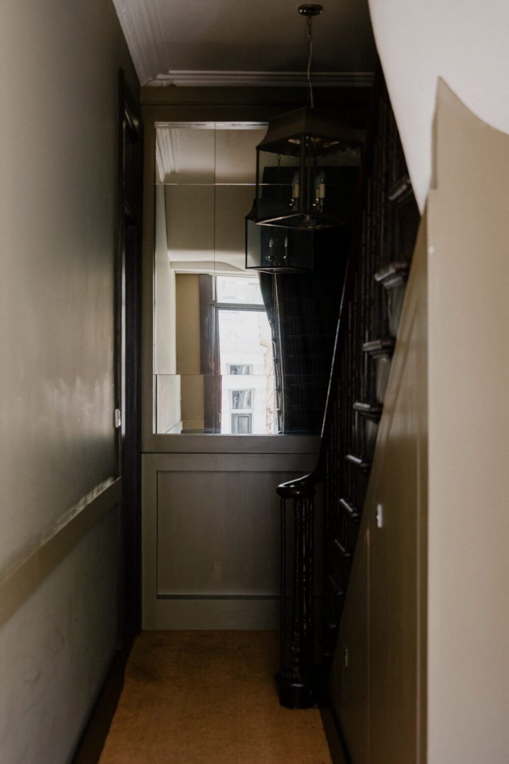 A Rich Color and Material Palette in a Small Victorian Apartment 20 small gray hall with large mirror