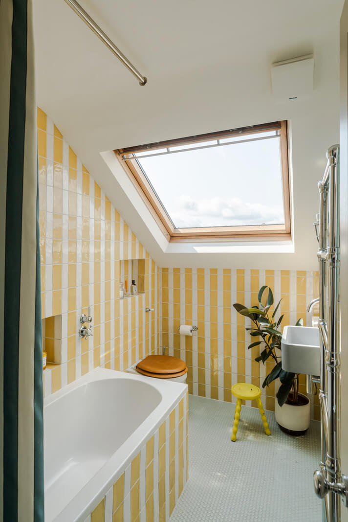 Best of 2025: Bathrooms 40 striped yellow tilework small bathroom slanted ceiling