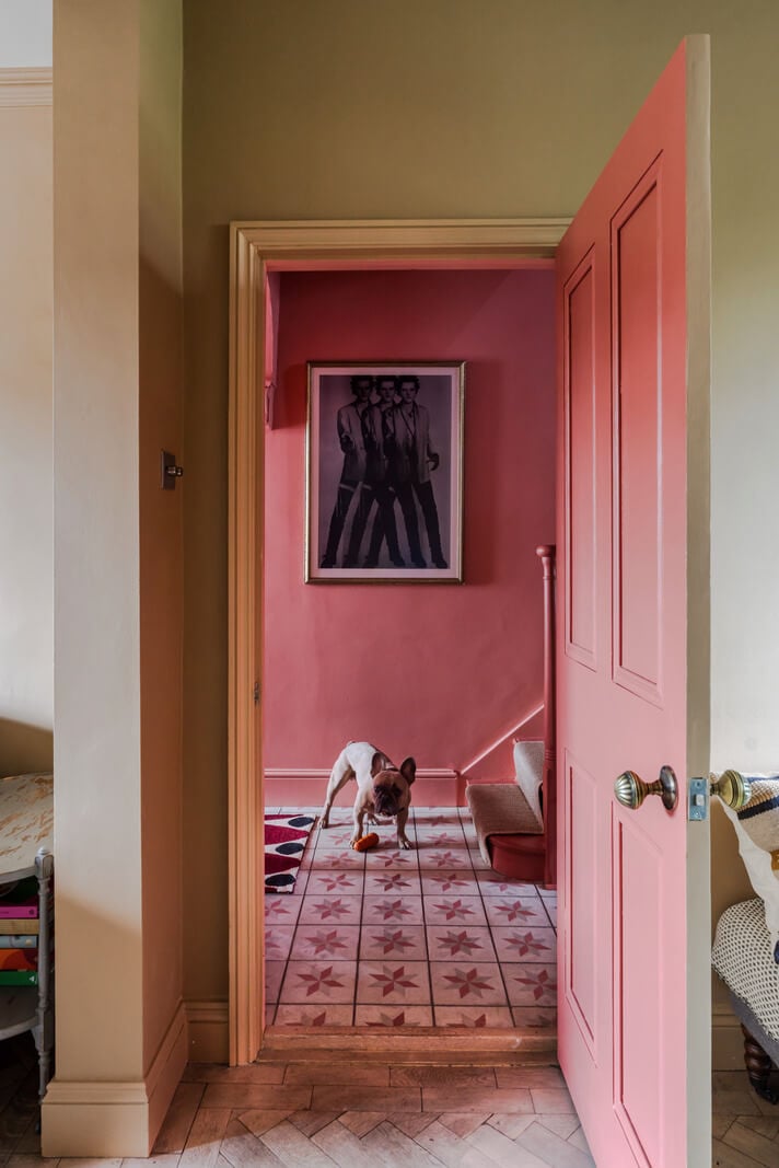 A Victorian Home with a Rich Color Palette and a Beautiful Garden 5 view into pink hall