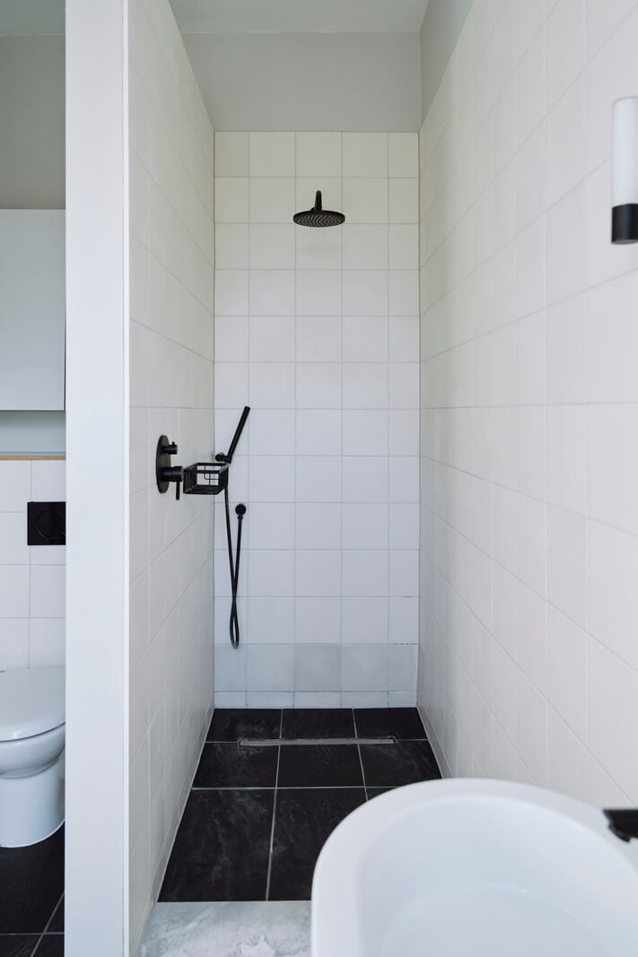 Colorful Rooms and a Modern Kitchen in a Spacious Family Home 20 white-tiled bathroom