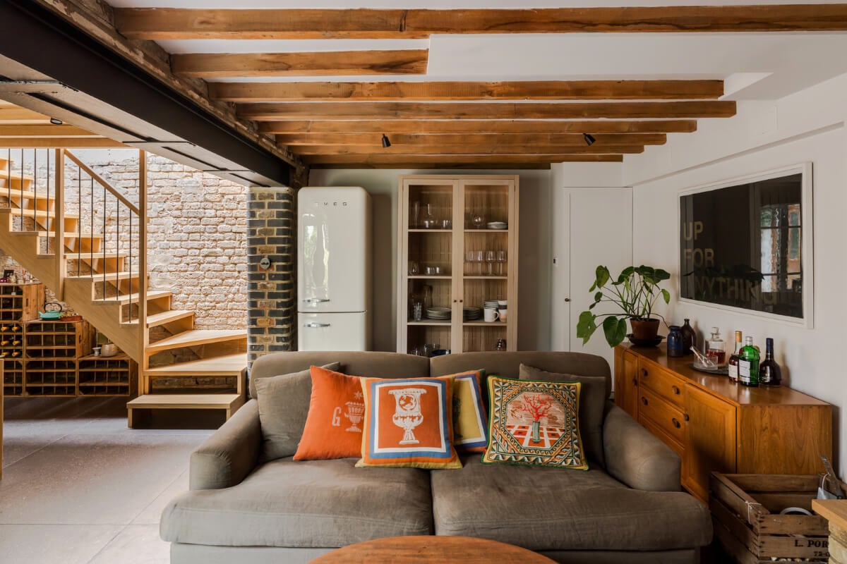 An Industrial Mews House with a Sebastian Cox deVOL Kitchen 4 wooden beams exposed brick living space mews house