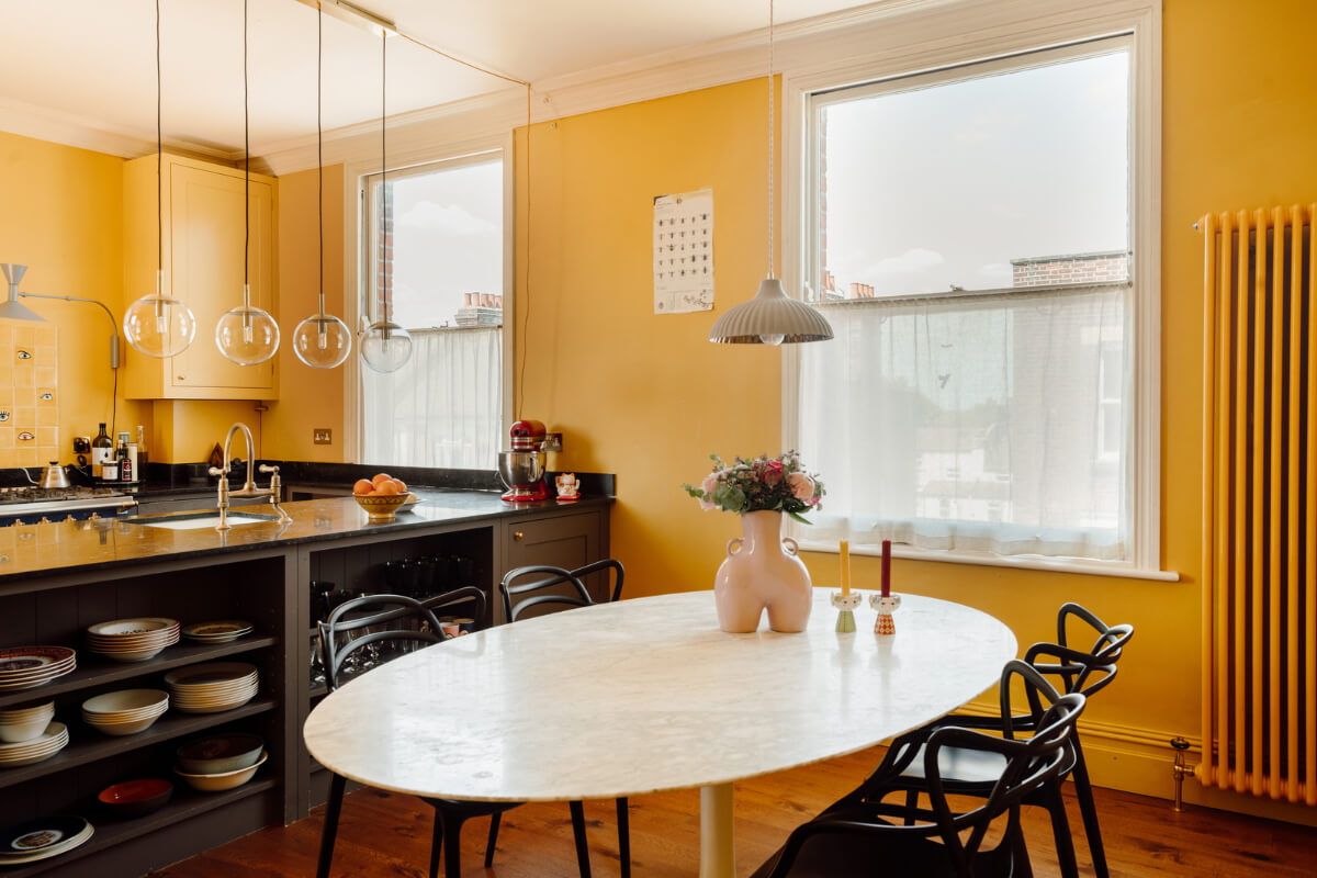 Pastel Tones and Deep Yellow in an Early 20th-Century London Apartment 13 yellow kitchen large dining table