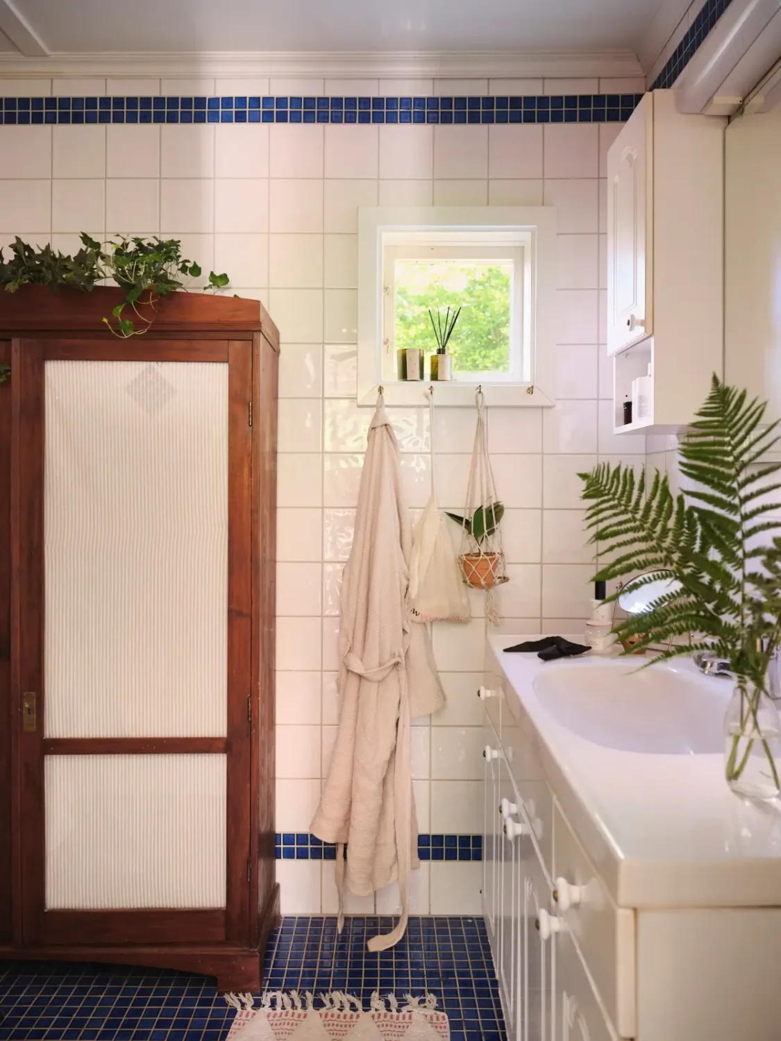 A Colorful Family Home in an Old Gardener's Cottage in Sweden 19 bathroom antique cabinet