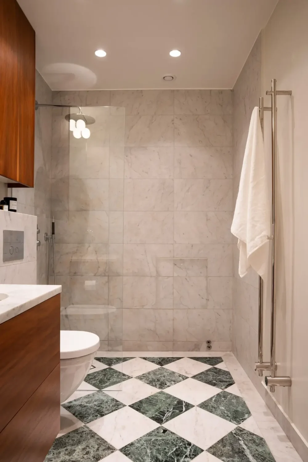 Arched Windows and Design Classics in a 19th Century Apartment 21 bathroom marble tiles checkerboard pattern