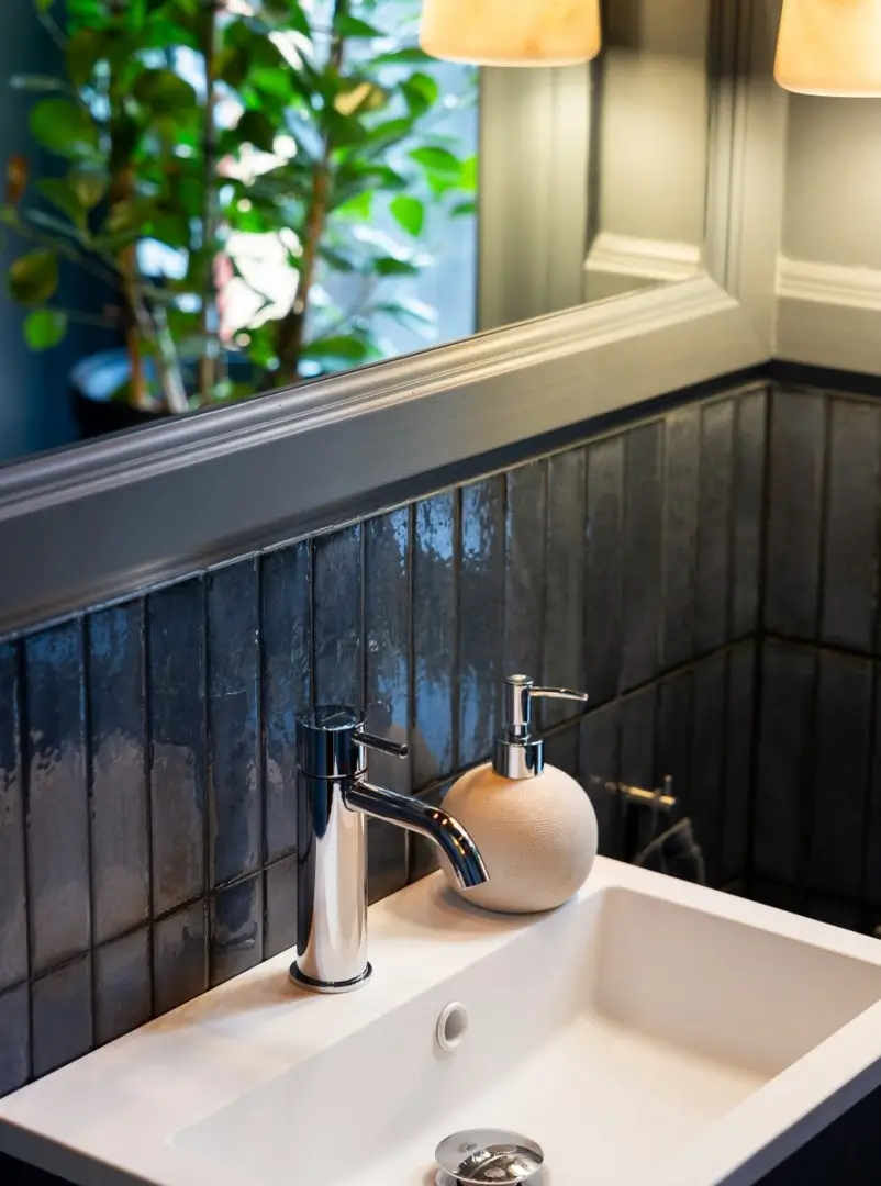 A Harmonious Color Palette in a Luxurious Stockholm Duplex Apartment 14 bathroom sink detail