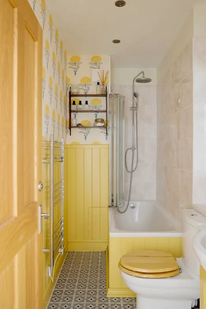 Pastel Hues in a Two-Bedroom Garden Apartment in West Kensington 17 bathroom yellow paneling nordroom